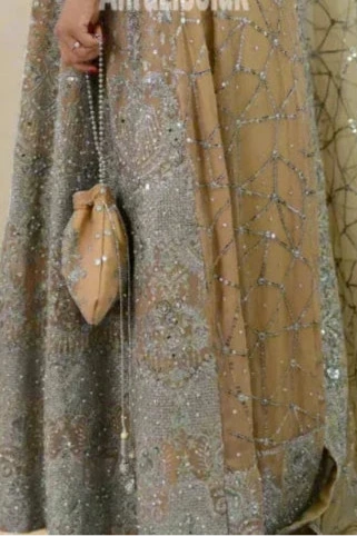 Long Heavy Anarkali Maxi outfit with matching potli bag