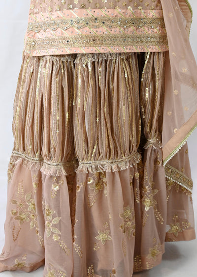 lehenga-suit-in-pink-ruffle-style-skirt