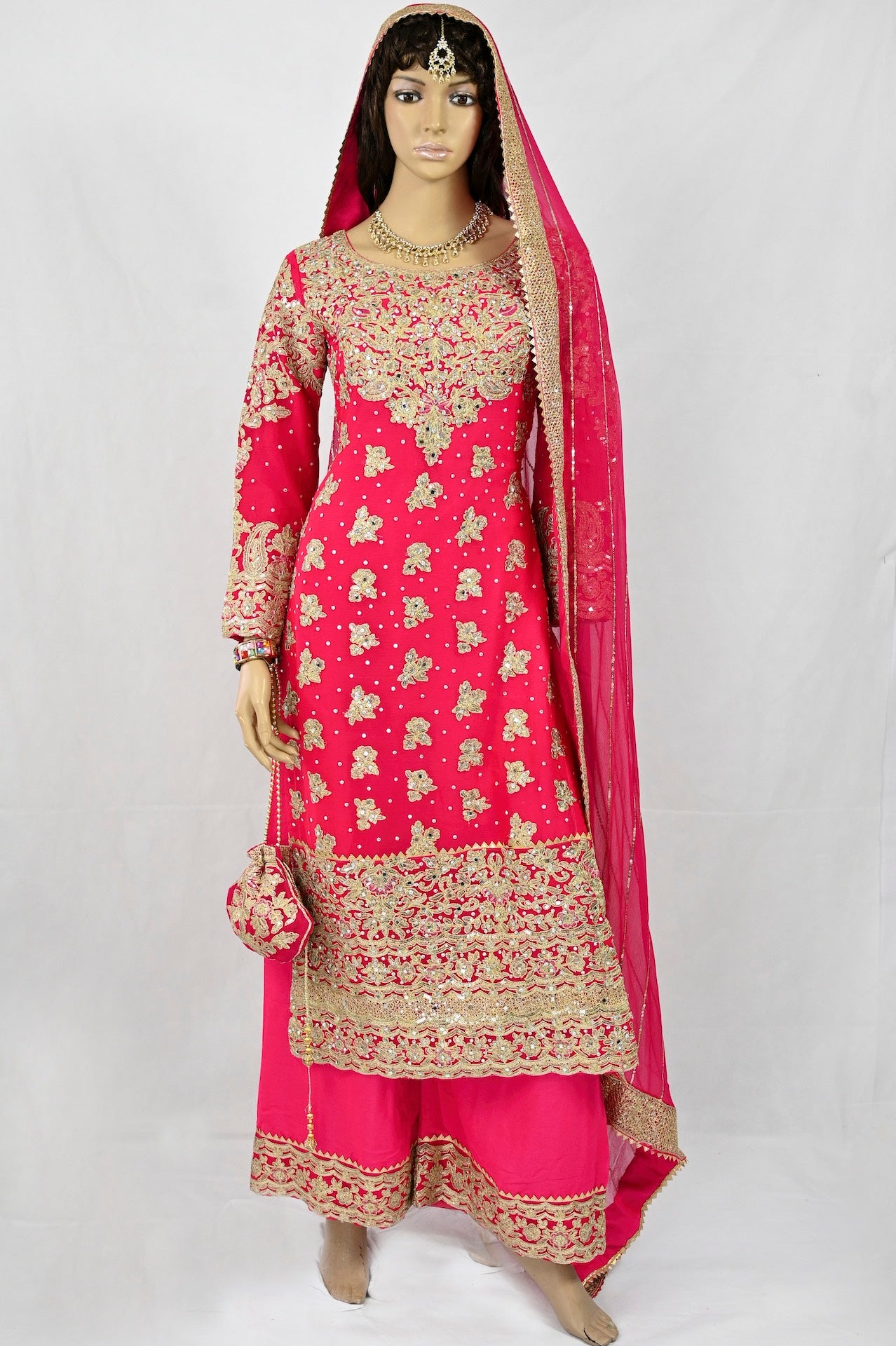 mehndi-outfit-in-hot-pink-gold-embroidery