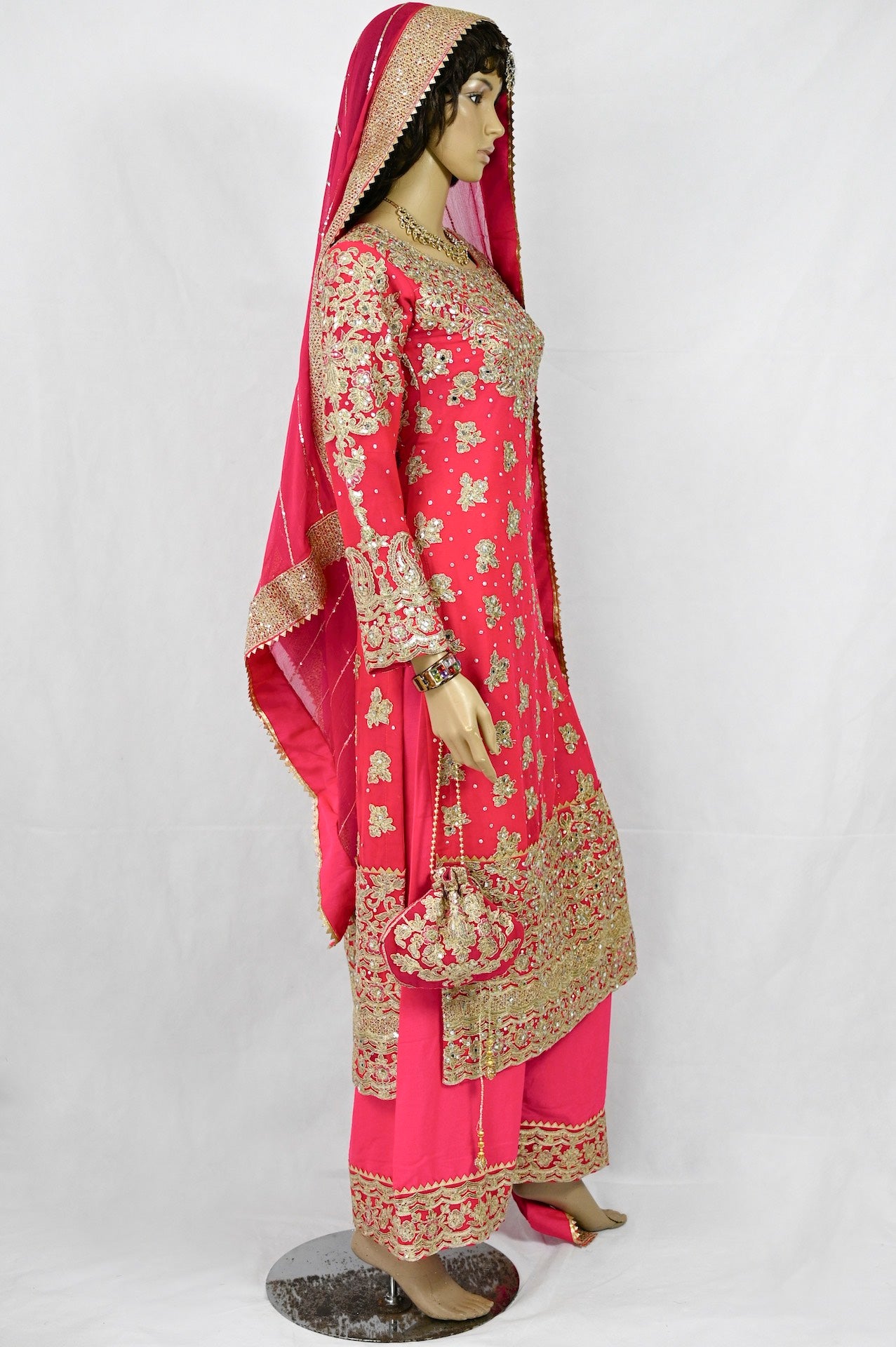 mehndi-outfit-in-hot-pink-gold-embroidery