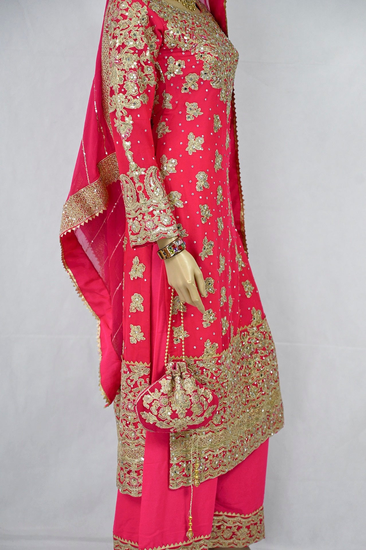 mehndi-outfit-in-hot-pink-gold-embroidery