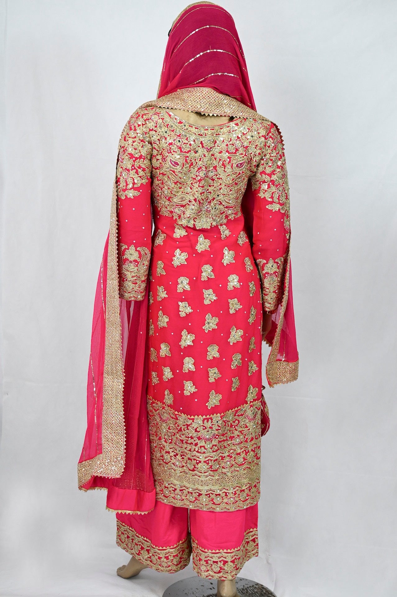 mehndi-outfit-in-hot-pink-gold-embroidery